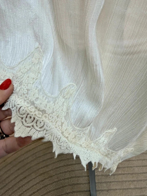 Tunica oversize panna con pizzo asimmetrico e spacco