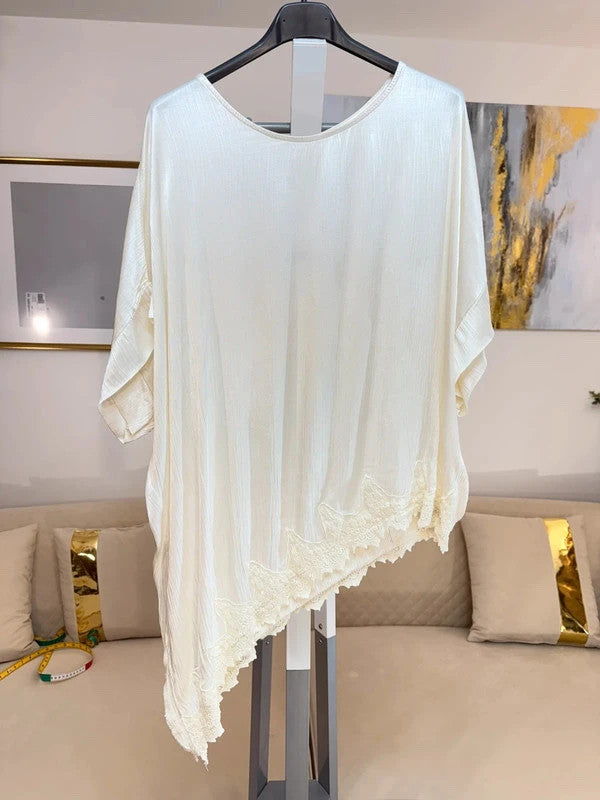 Tunica oversize panna con pizzo asimmetrico e spacco