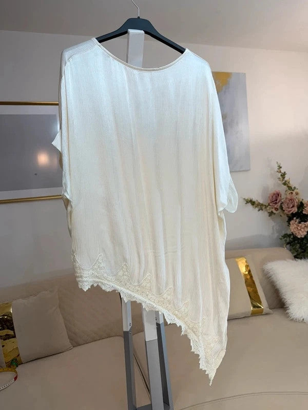 Tunica oversize panna con pizzo asimmetrico e spacco