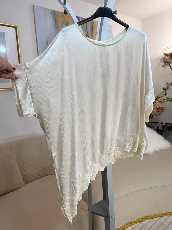 Tunica oversize panna con pizzo asimmetrico e spacco