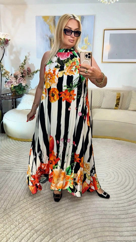 Vestito lungo fluido con stampa floreale 🌺 elegante e scenografico