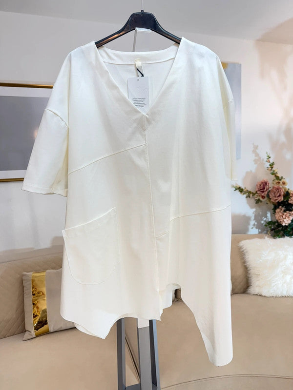 Blusa oversize panna con taglio asimmetrico e tasca